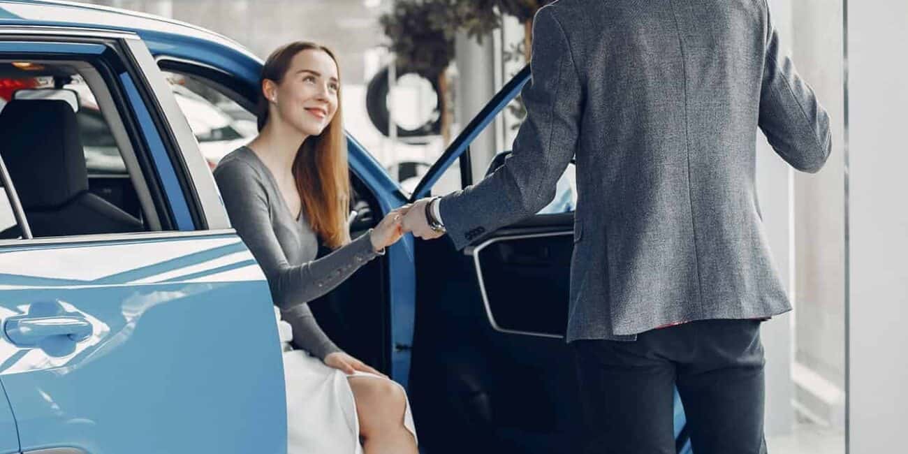 Elegant couple in a car salon