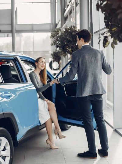 Elegant couple in a car salon